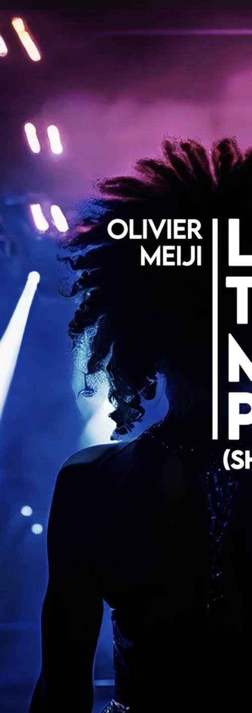 Live performer silhouetted under stage lights