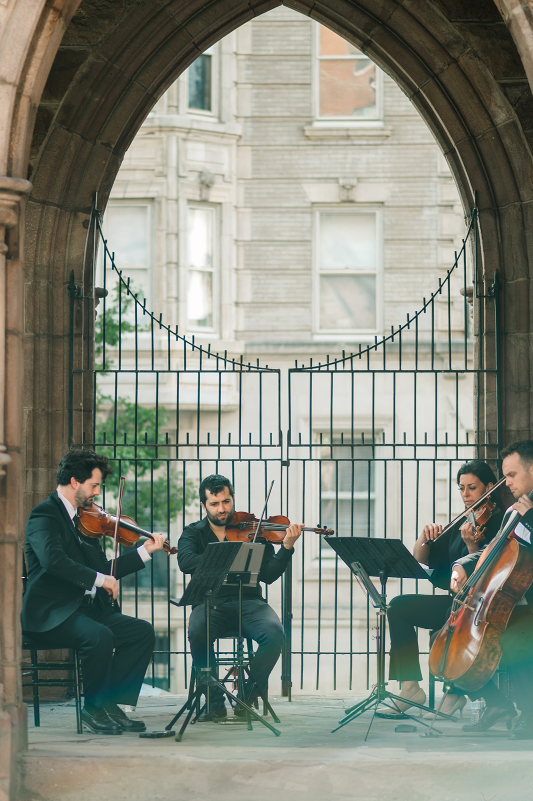Bride walking down the aisle with string quartet performing